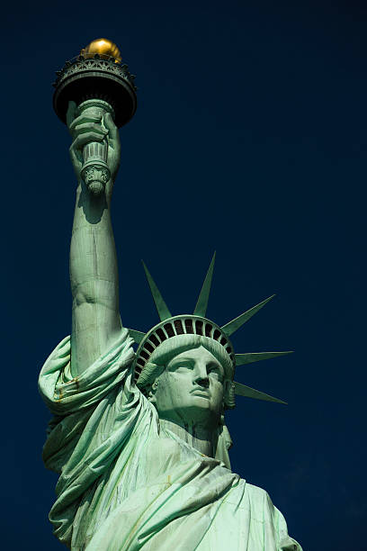 istock Dramatic image showing Statue of Liberty against blue sky 174627618