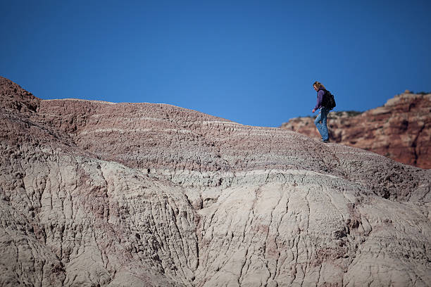 istock Woman hiking in the desert 174628770