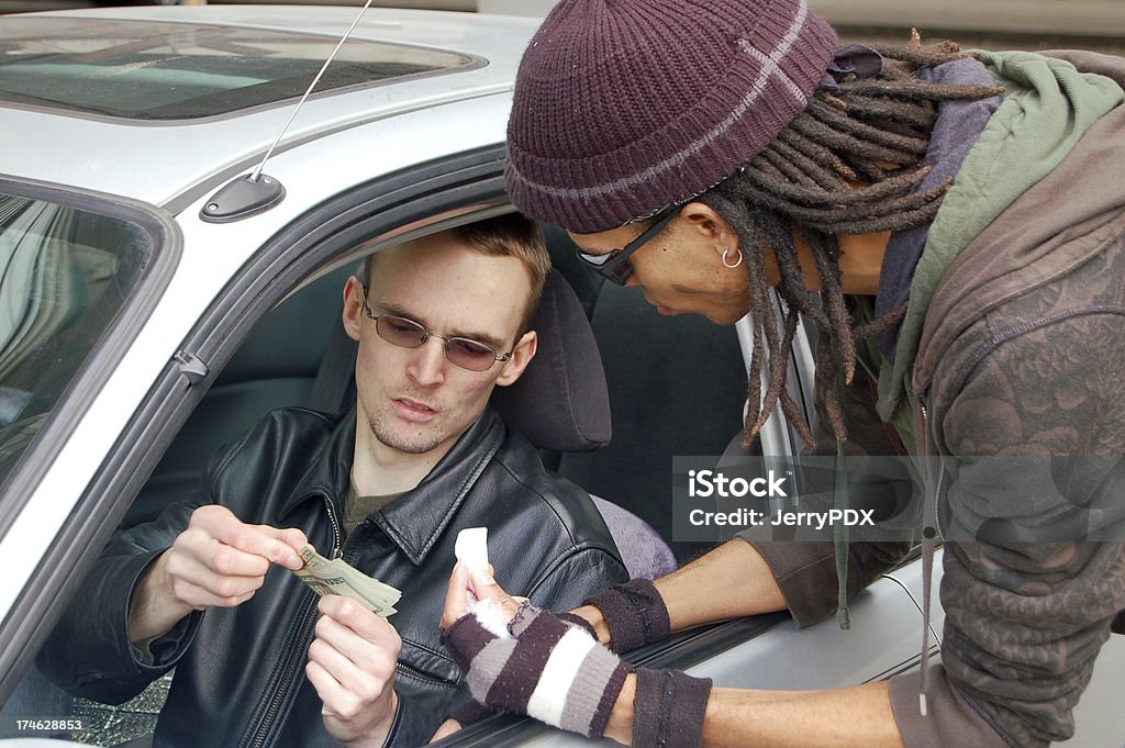 Big Buy Addict makes drug purchase from his car window.Similar druggie shots: Used Car Selling Stock Photo