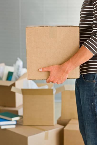 istock Closeup of carboardbox in young man's hand 174628889