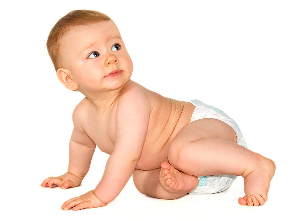 istock Small child crawling and looking backwards wearing diapers 174629356