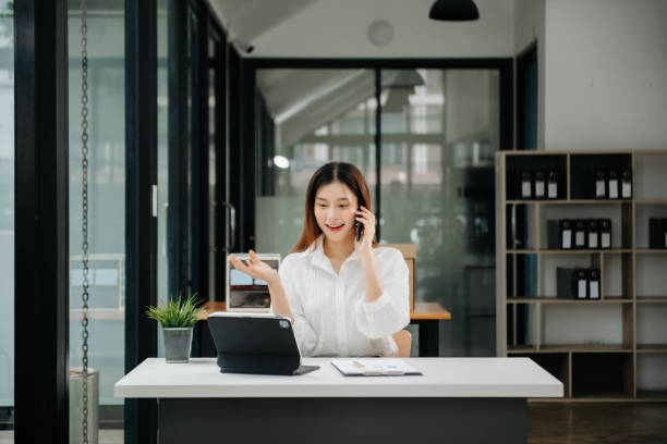 istock Asian businesswoman working in the office with working notepad, tablet and laptop documents 1746293780