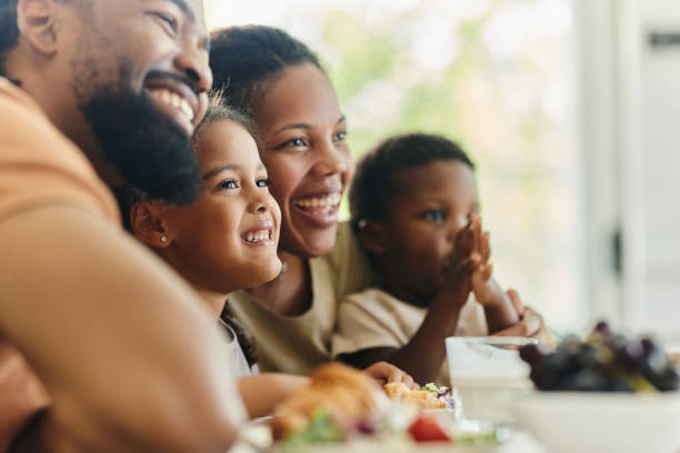 istock Happy black family enjoying during breakfast at dining table. 1746293805