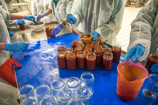 Glass jars with different kinds of jam
