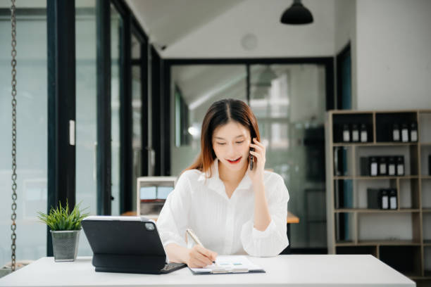 istock Asian businesswoman working in the office with working notepad, tablet and laptop documents 1746293827
