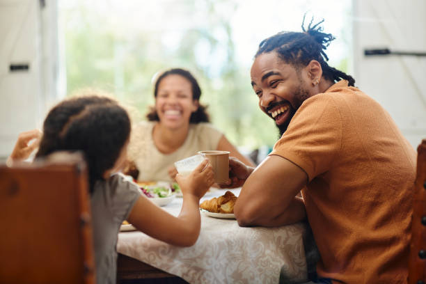 istock Happy black father and daughter toasting during breakfast at home. 1746295743