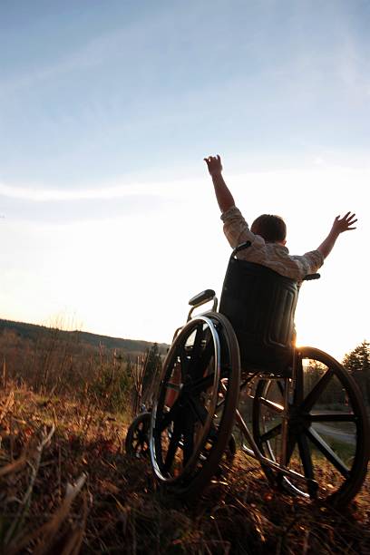 istock Wheelchair Sunset Praise 174629715