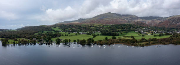 istock Coniston lake village and Old Man 1746300241