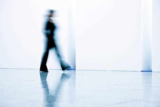istock Motion blurred young businesswomen walking 174630026