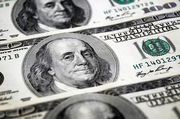 istock One hundred dollar bills, shallow DOF 174630035