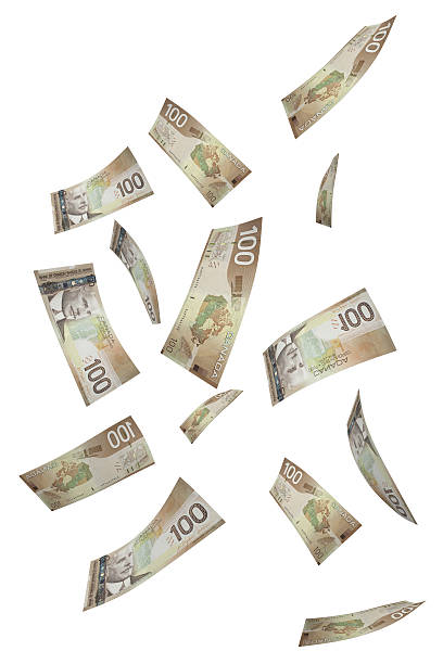 fallenden hundert-dollar-noten in der hand - canadian dollars canada bill one hundred dollar bill stock-fotos und bilder