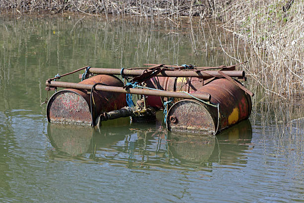 Raft made of rusty drums stock photo