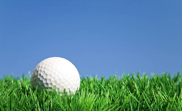istock Golf ball on green grass on a sunny day 174631636