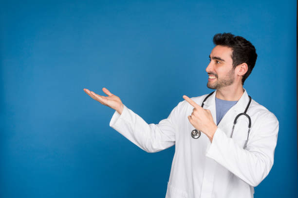 istock young doctor pointing finger at copy space 1746323328