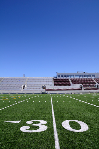 An American football field. The surface is artificial turf. Adobe RGB color profile.