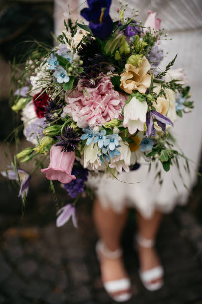 istock the bride holds a colorful wedding bouquet in her hand 1746326149