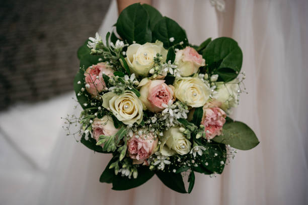 istock the bride holds a pink wedding bouquet in her hand 1746326708