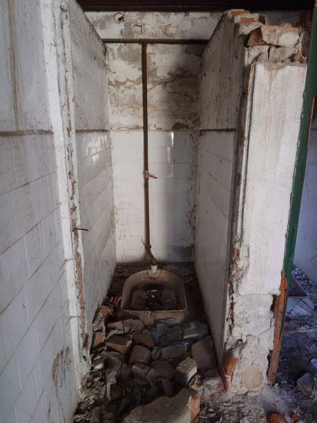 istock Run down or dilapidated and abandoned building interior shower space in eastern Europe. Wide angle, natural light, no people 1746328753