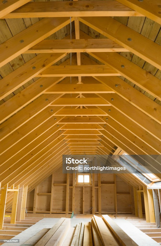 The attic of a newly built house "Attic space in newly-built house, ready for conversion." Residential Building Stock Photo