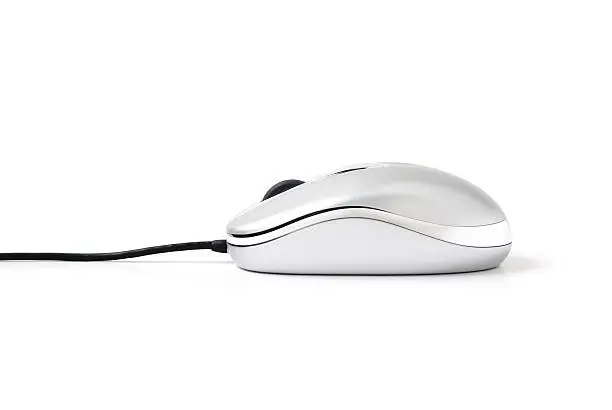 Photo of A silver computer mouse on a white background