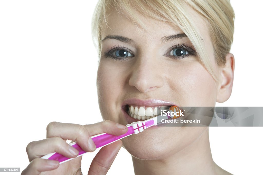 happy blond with toothbrush happy blond with toothbrush on white background Adult Stock Photo