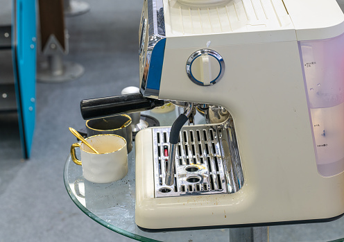 Modern coffee machine and cup