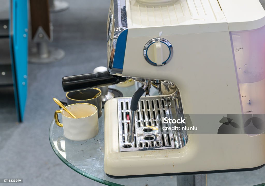Modern coffee machine and cup Arabica Coffee - Drink Stock Photo
