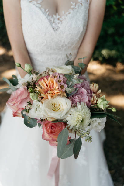 istock the bride holds a colorful wedding bouquet in her hand 1746333865