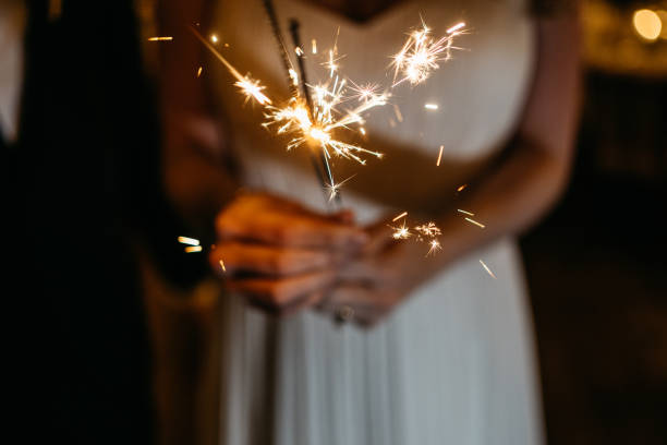 istock Bride holding a miracle candle in her hands at her wedding party 1746338386