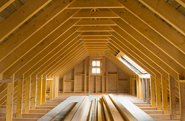view of a-frame attic in a newly-built home - dakbalk stockfoto's en -beelden