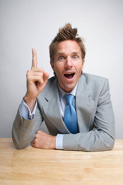 istock I've Got It! Businessman Office Worker Pointing Inspired at Desk 174634034