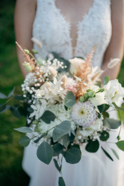 istock the bride holds a colorful wedding bouquet in her hand 1746340769