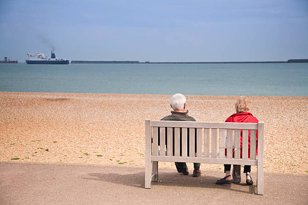 istock Senior Citizens couple looking out at sea 174634151