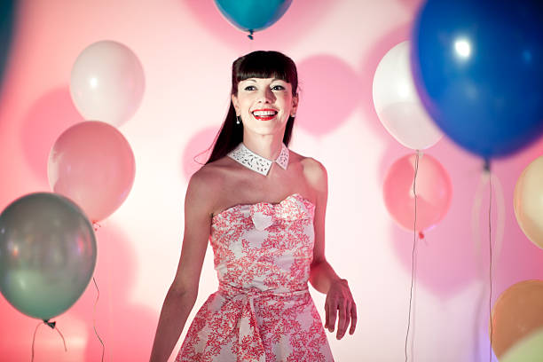 istock Woman with balloons 174634157