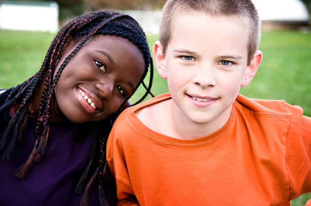 принят молодые подростков брат и сестра - adoption family multi ethnic group human teeth стоковые фото и изображения