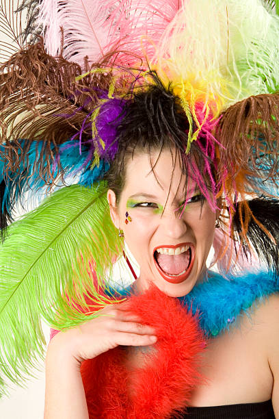 Happy Color An excited girl framed by ultra-colorful feathers ostrich feather stock pictures, royalty-free photos & images