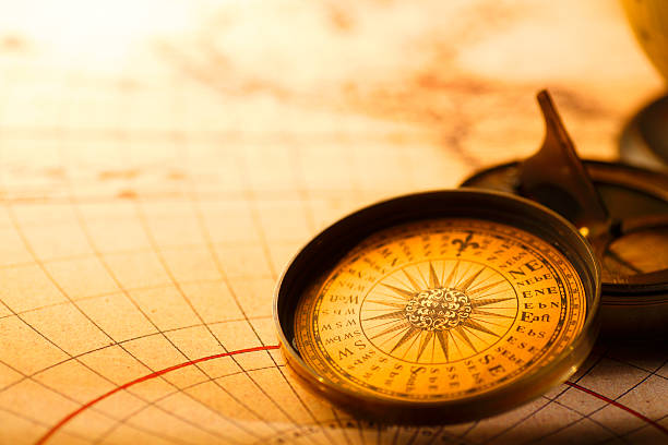 istock Compass Rose Sitting On Top Of A Compass Warmly Lit Background 174635433