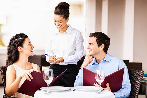 istock Waitress Taking Order From Couple At Restaurant 174635874