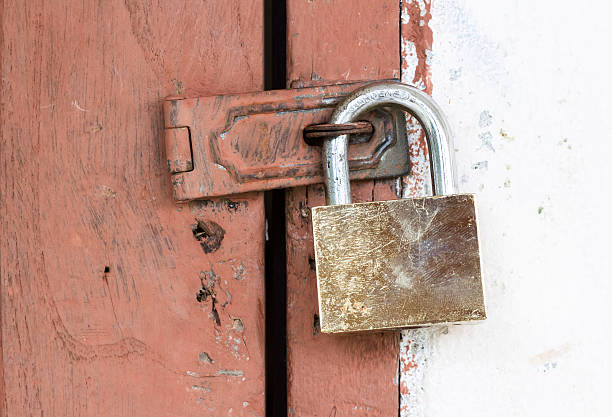 istock Door locked by brass padlock 174636019
