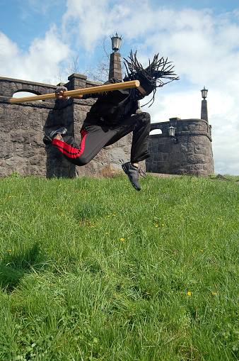 Ninja flies across the front of the castle... some say he fell off his broomstick.Similar Shots: