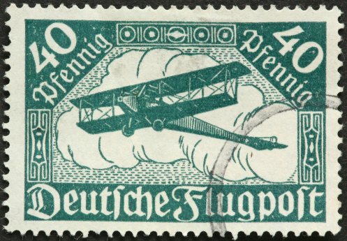 very old German biplane, vintage postage stamp.
