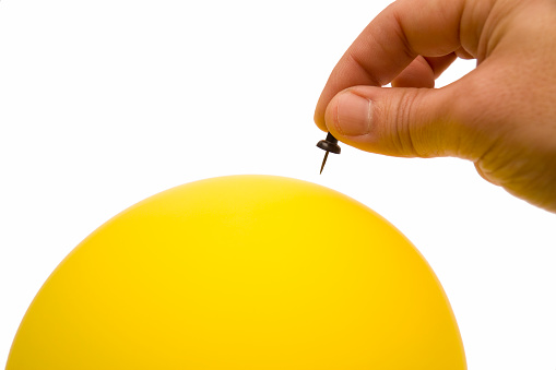 Needle and a yellow Balloon