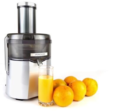 Using a juicer to extract juice from vegetables and fruit as a source of vitamins