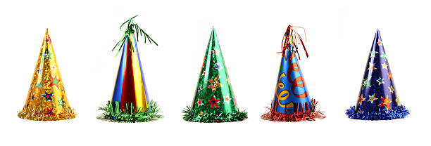 Five colorful party hats on a white background stock photo