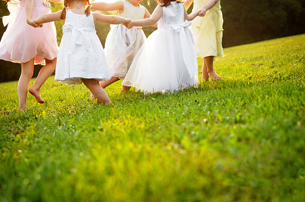 happy little baile princess niñas en vestidos - child dancing preschooler outdoors fotografías e imágenes de stock