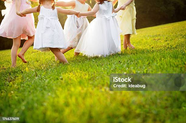 Happy Little Dancing Princess Girls In Dresses Stock Photo - Download Image Now - Child, Ring-Around-The-Rosy, Playful