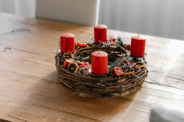 istock Rustic advent wreath with four candles lit every sunday before christmas. 1746378740