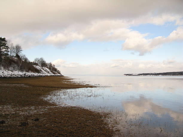 The Avon river in Nova Scotia viewed in the Winter at high tide from Hantsport.This view is looking towards the Minas Basin at the head of the Bay of Fundy. This area is home to the highest tides in the World.