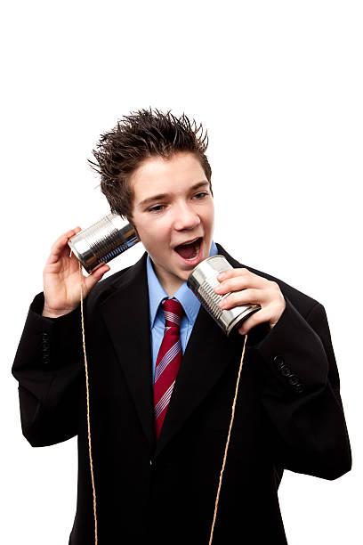 istock Listening and talking to a tin can phone 174638407