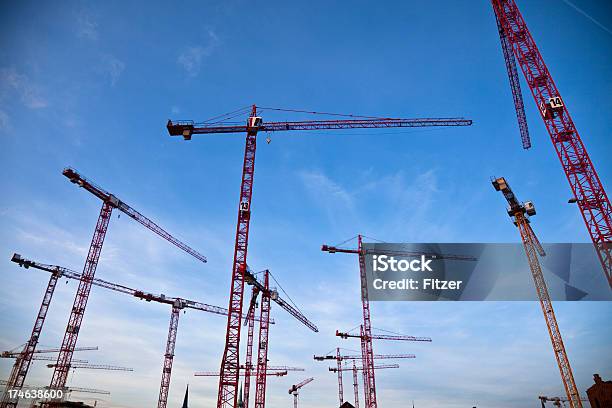 Crane Ballet At Sunset Stock Photo - Download Image Now - Architecture, Blue, Color Image